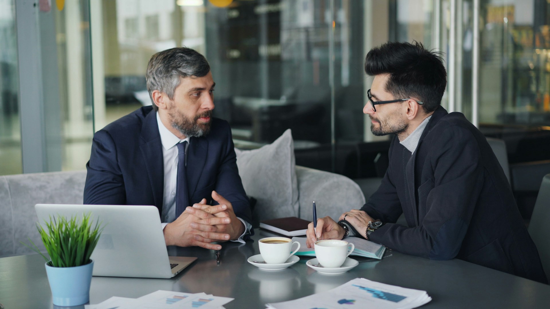 Financial advisor discussing Qualified Opportunity Zone investing with a client
