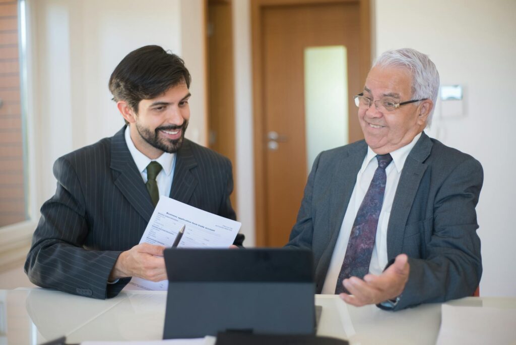 Tax professional discussing QSBS tax benefits with a client in a modern office setting under IRC Section 1202.